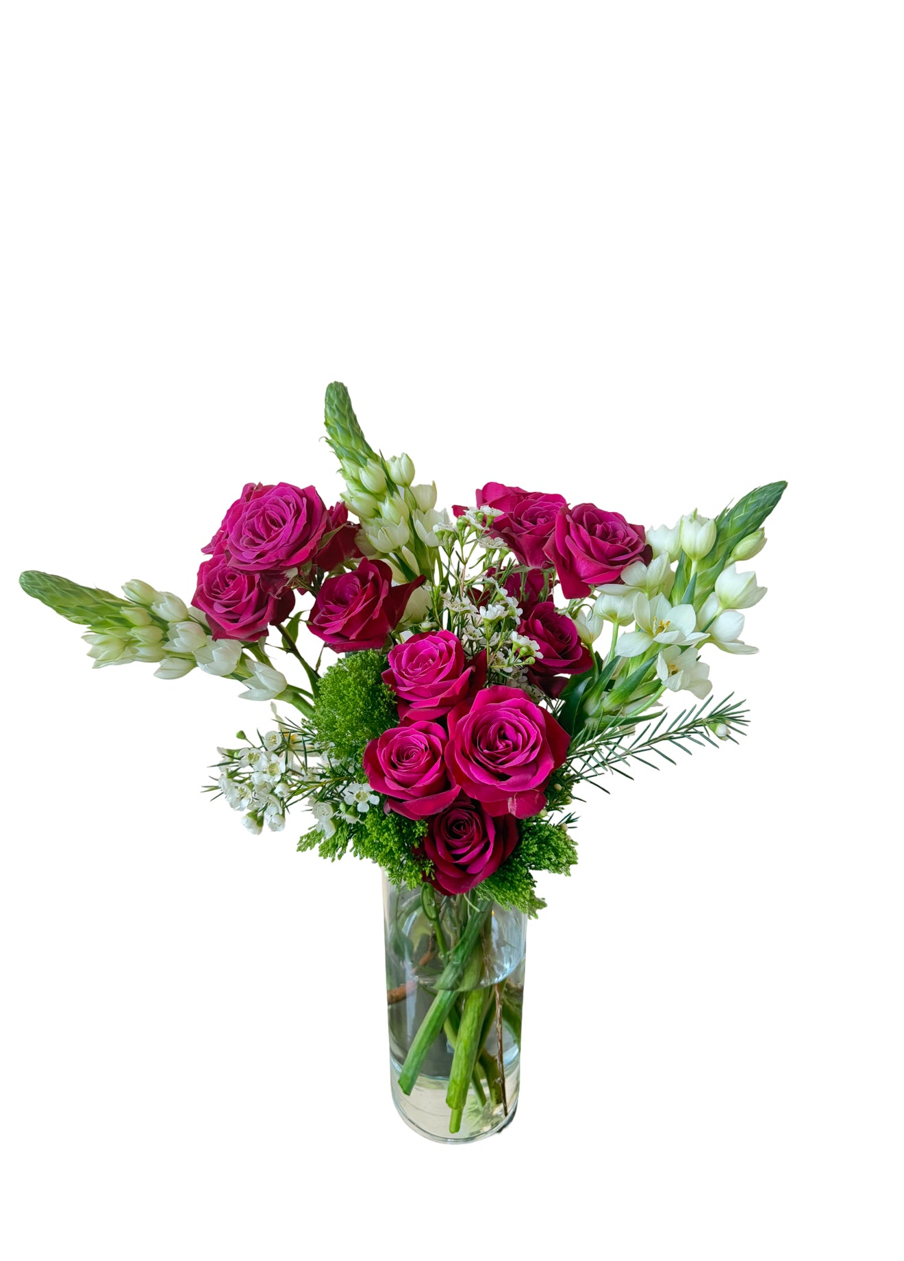 This floral arrangement from L’amour Floral Designs is a cheerful mix of soft pink and lavender roses, light pink carnations, delicate white blooms, and lush greenery displayed in a clear glass vase. The colors are balanced beautifully, evoking a romantic and uplifting tone perfect for springtime occasions or heartfelt sentiments. The arrangement is fresh, airy, and feminine, ideal for expressing love, appreciation, or warm wishes.