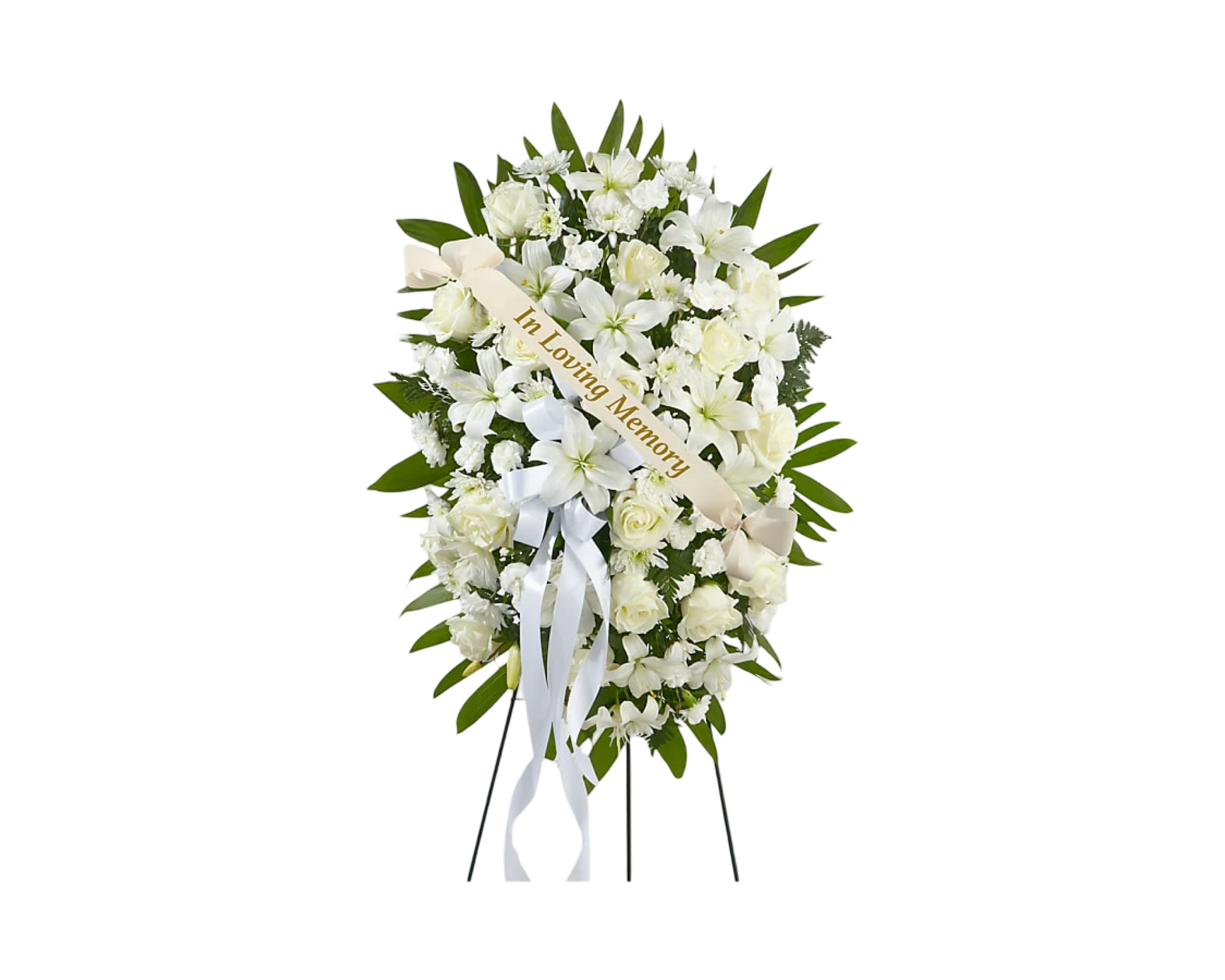 A classic and reverent standing spray in an oval shape, composed entirely of white flowers including roses, lilies, carnations, and chrysanthemums, accented with dark green foliage. Displayed on a black easel and adorned with a cream ribbon that reads "In Loving Memory," this sympathy arrangement offers a timeless expression of peace and remembrance.