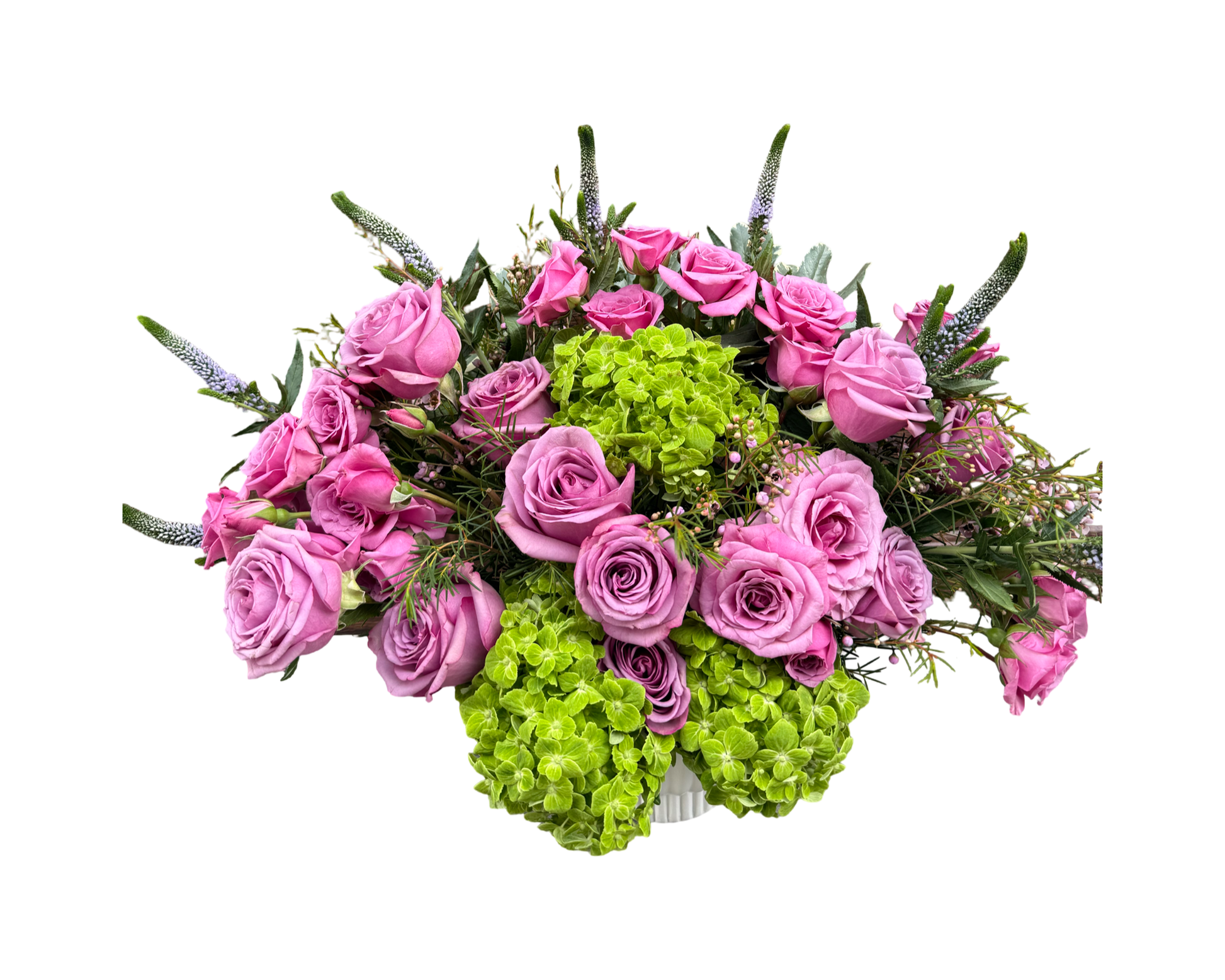 A luxurious dome-shaped bouquet bursting with lush pink roses and vivid green hydrangeas. The arrangement is styled in a low round container, creating a vibrant and modern centerpiece perfect for upscale events or thoughtful gifting.
