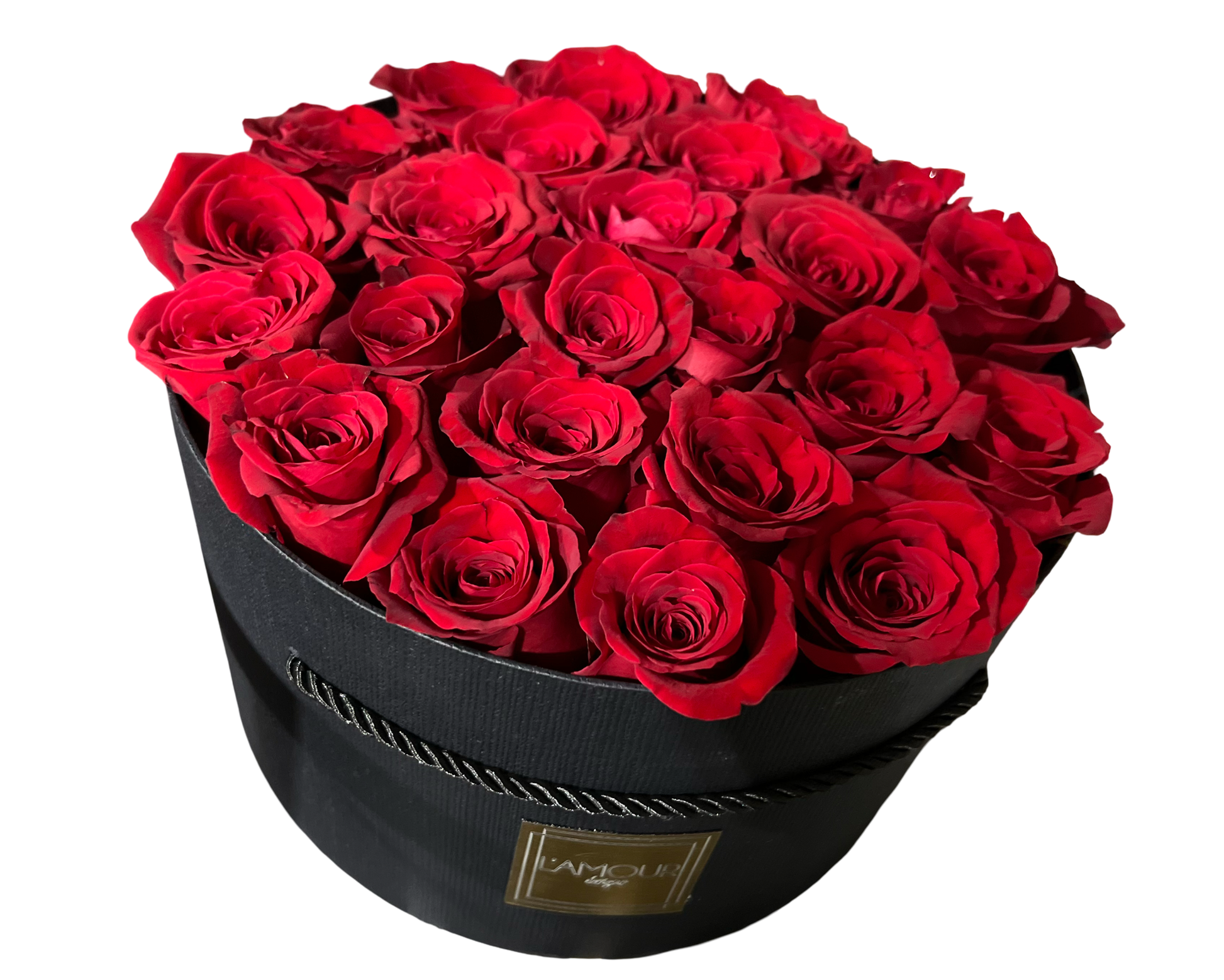 A luxurious and classic floral presentation featuring deep red roses meticulously arranged in a sleek round black hatbox from L’amour Designs. The tight dome of velvety roses is rich in color and romance, making it a bold and unforgettable gift—perfect for grand gestures of love and admiration.